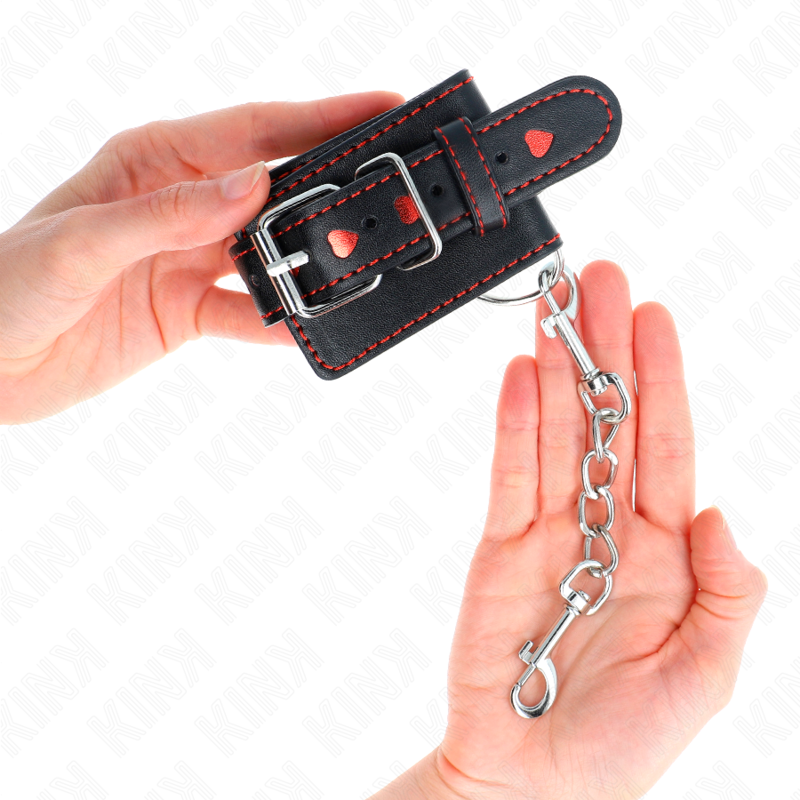 KINK - APPUI-POIGNETS NOIR AVEC INCRUSTATION COEUR ROUGE RÉGLABLE 21-28 CM X 5,5 CM - Sensualia